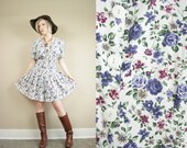 Purple Floral Print Button Up Drop Waist Romper Dress