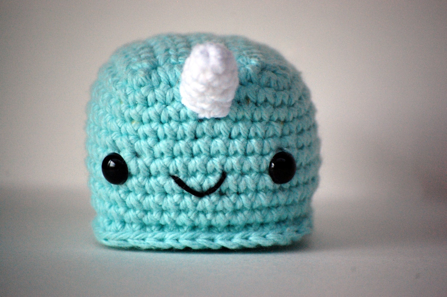 MEDIUM sized Ned Narwhal amigurumi pictured in light teal, also available in lavender & tangerine