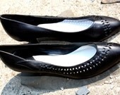 1980s black leather heels  Hip cut out design...size 9 Medium by Connie, timeless beauties