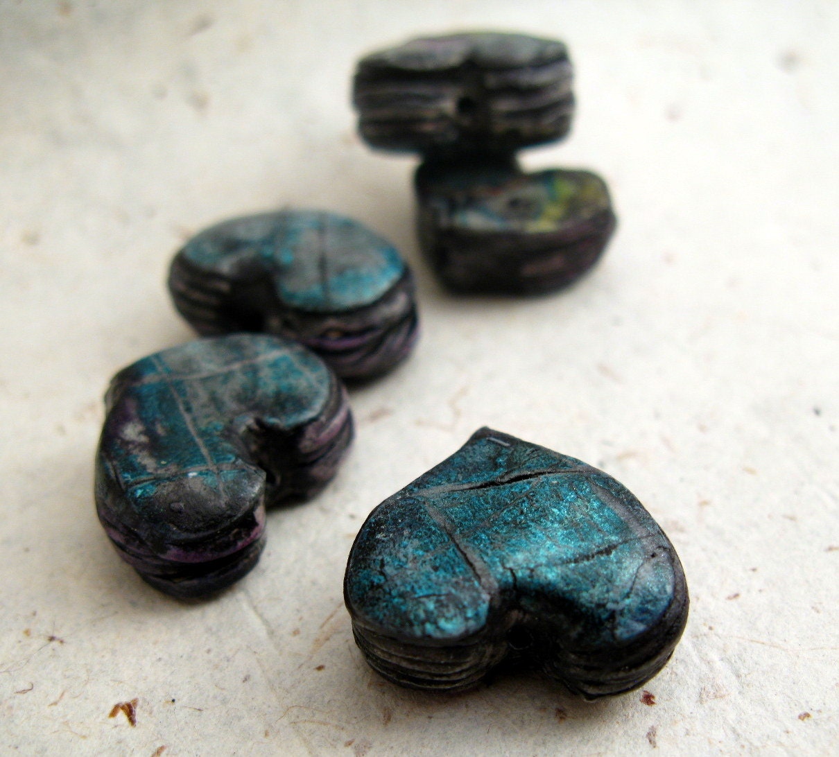 Distressed rich blue metallic heart strata beads in polymer clay