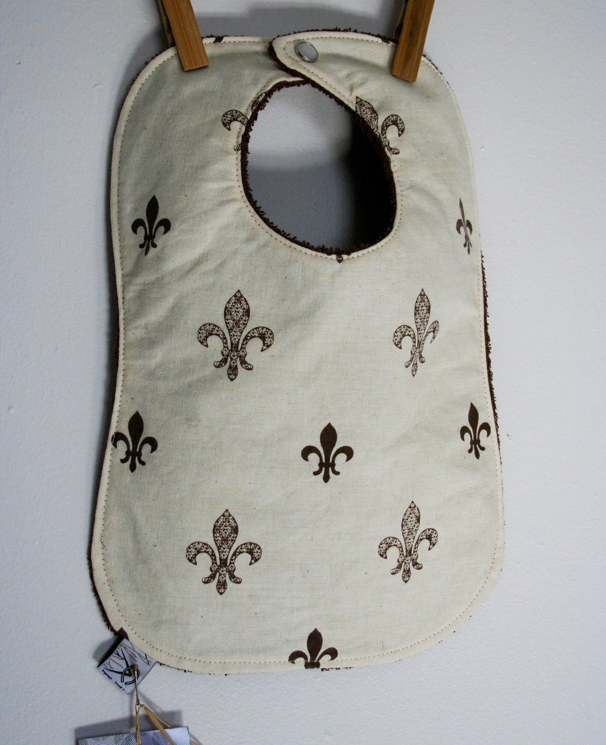 Handmade and printed fleur de lis baby bib