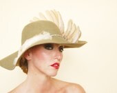 The Pearl" : wide brim felt hat with taxidermy wing