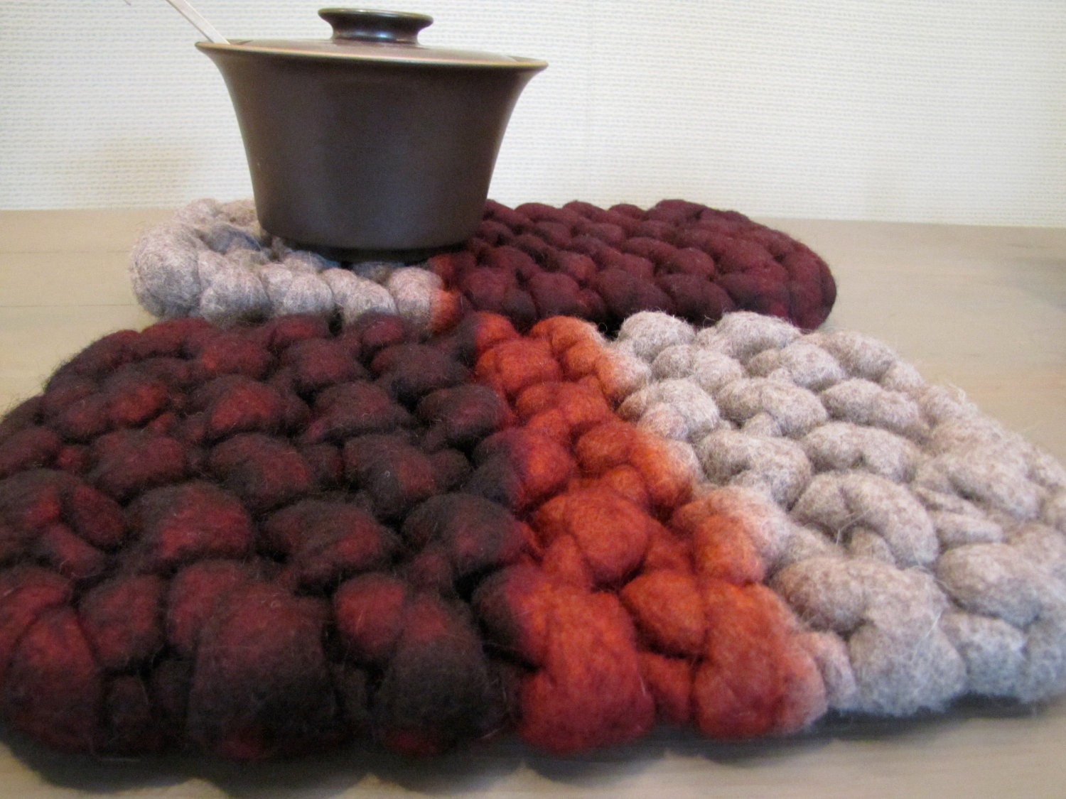 Extra chunky hand knit wool felt natural wool trivet in gray and dip dyed crimson red