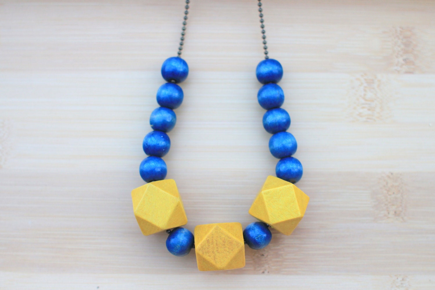 NECKLACE Geometric Wood Beads in Navy and Yellow strung on Antique Brass Ball Chain