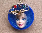 THE ARTIST - upcycled Barbie Doll face pendant