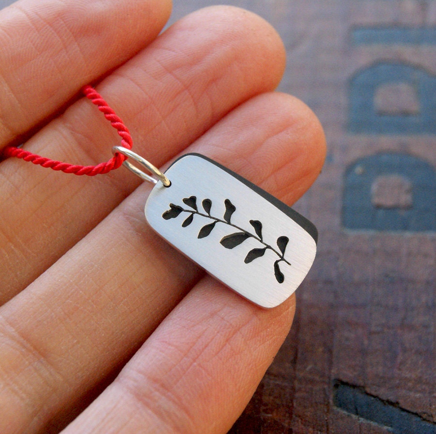 Mini Frond, a layered silhouette pendant