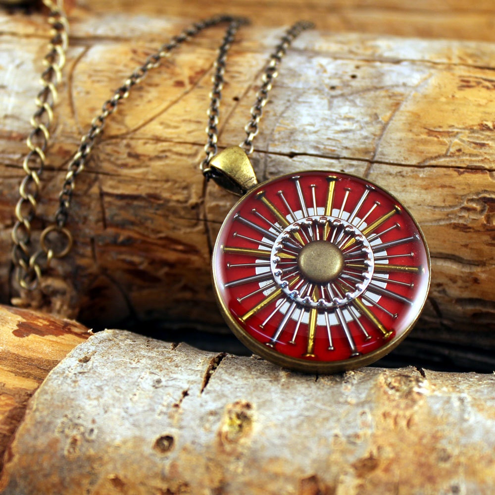 red nail burst necklace in brass