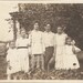 antique photo of a victorian family out in the garden - great hair and fashions - super vintage photo