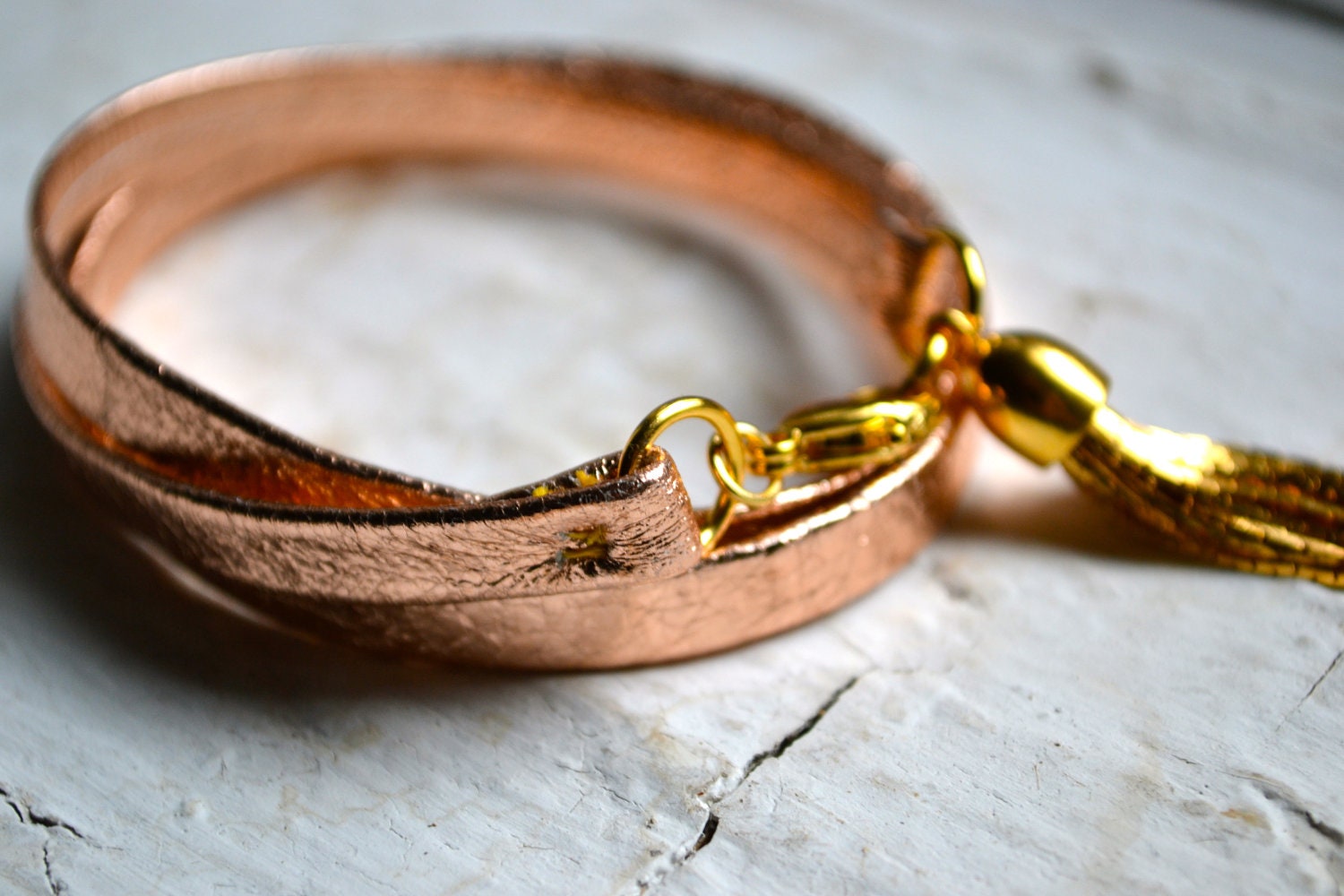 metallic rose gold genuine leather triple wrap bracelet with gold tassel