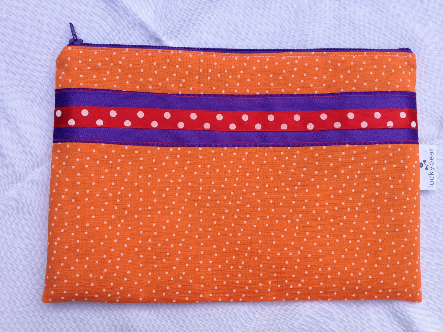 Large flat makeup pouch in zingy orange polka dots