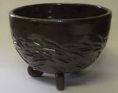 Cute three footed bowl in green