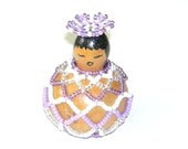 Beaded gourd doll with basket