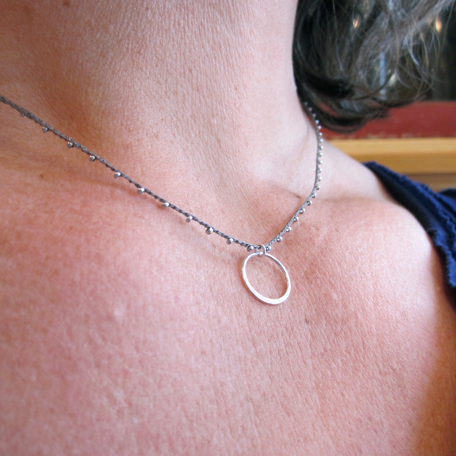 Sterling silver circle charm on daintiest crocheted beaded necklace with silver and gray strand