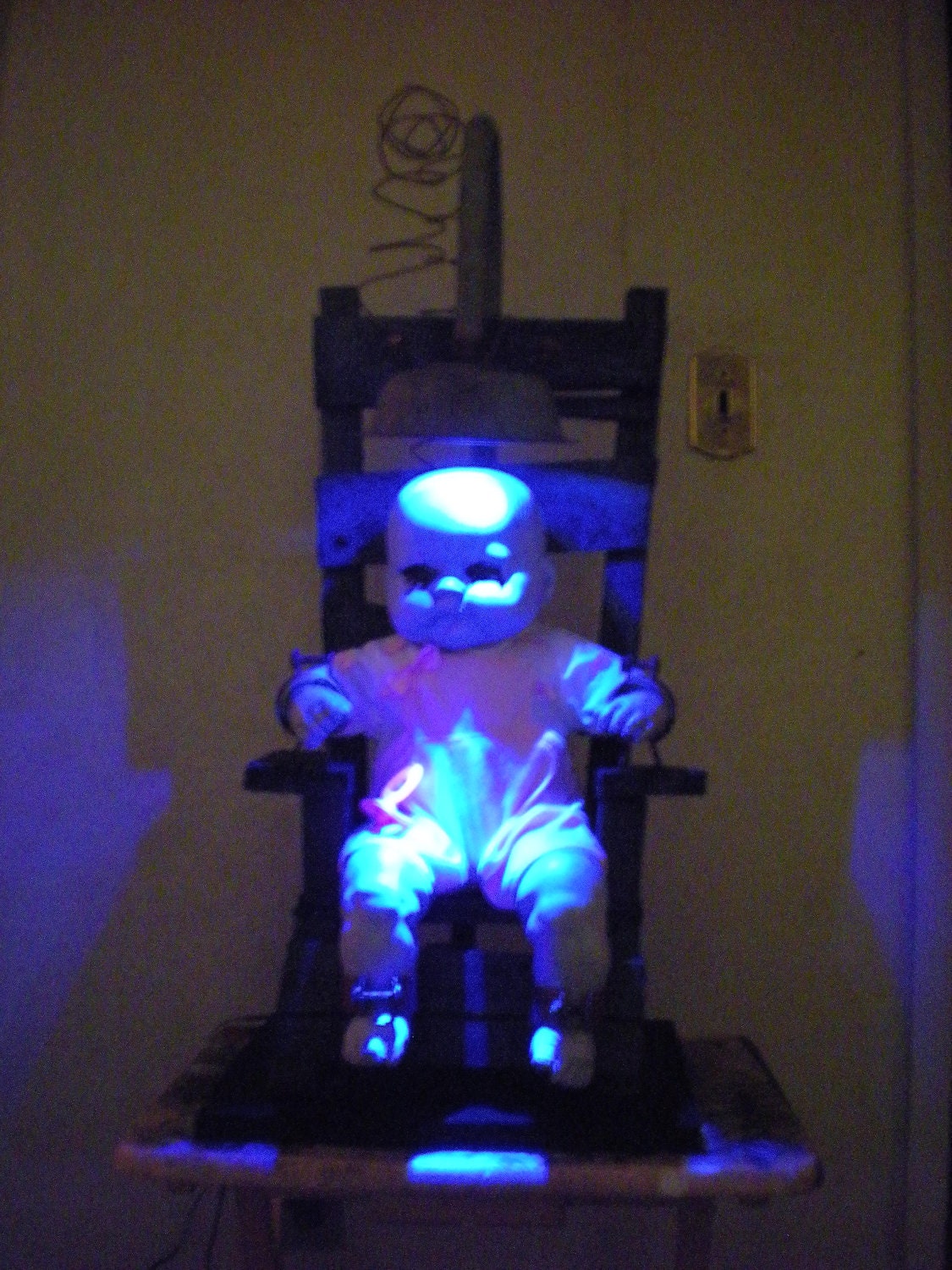 The orphanage.  Life size electric chair with lightning effect lights.