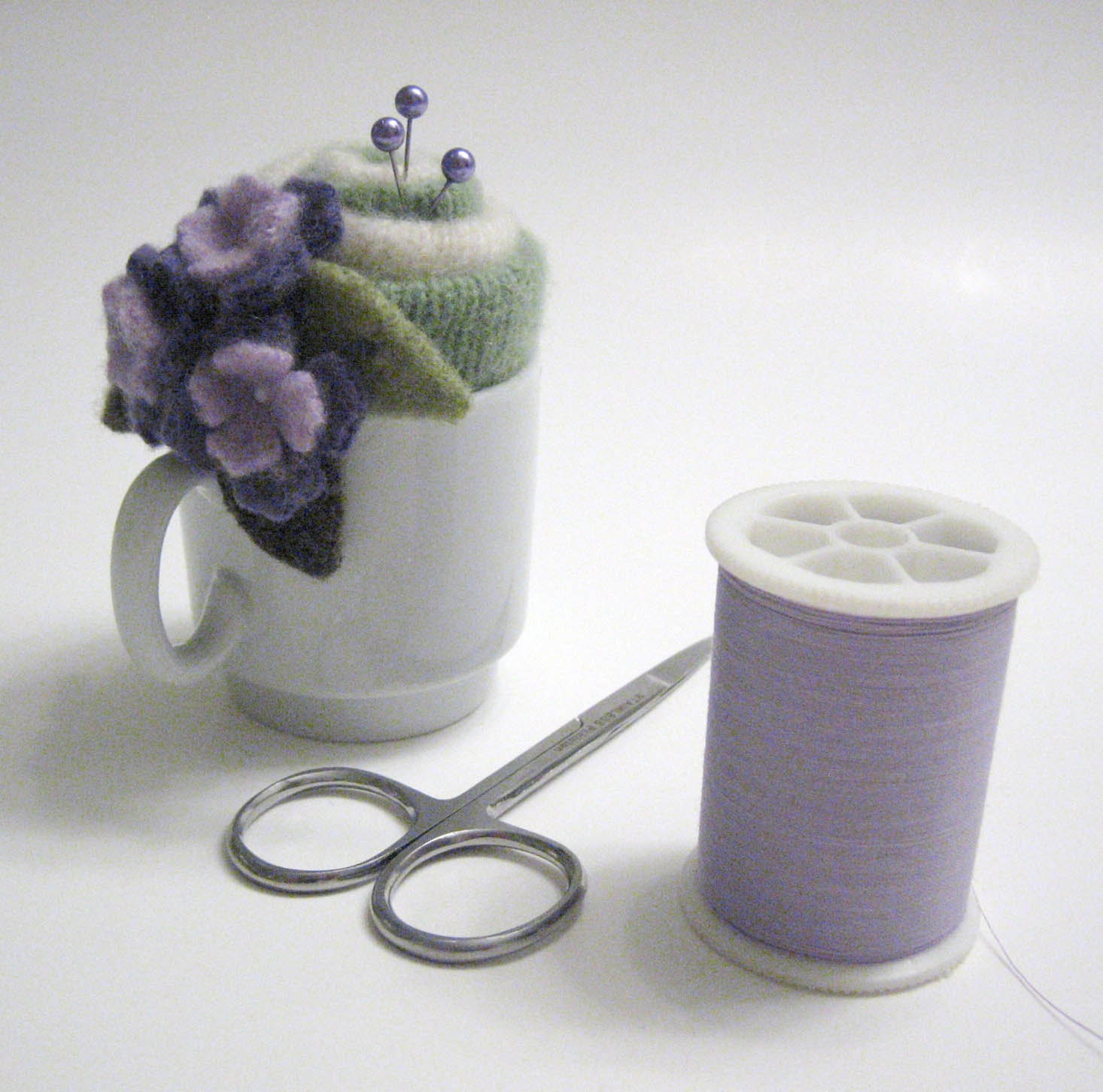 Green Swirl Needlecraft Pincushion with Purple Flowers Handmade from Felted Wool and Cashmere