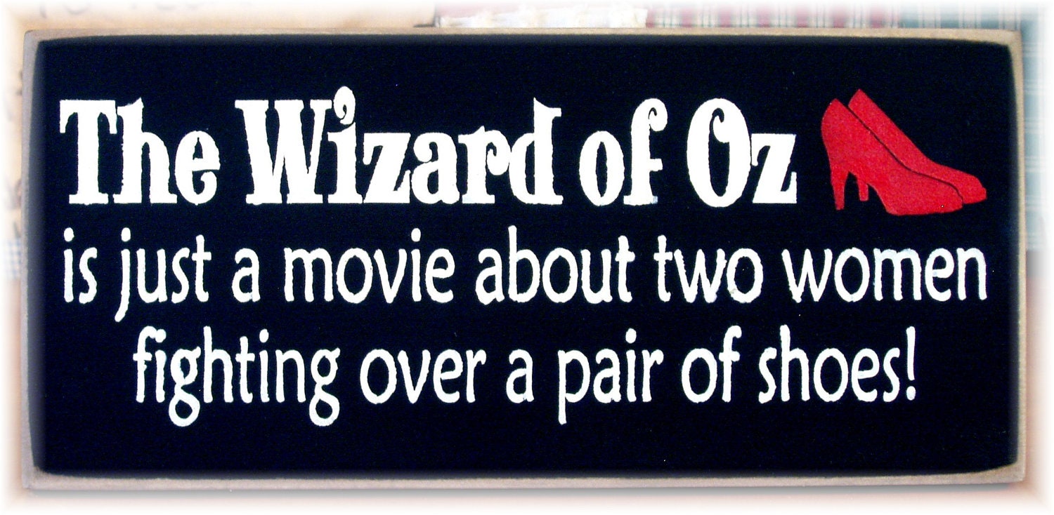 Th Wizard Of Oz is just a movie about two women fighting over a pair of shoes wood sign