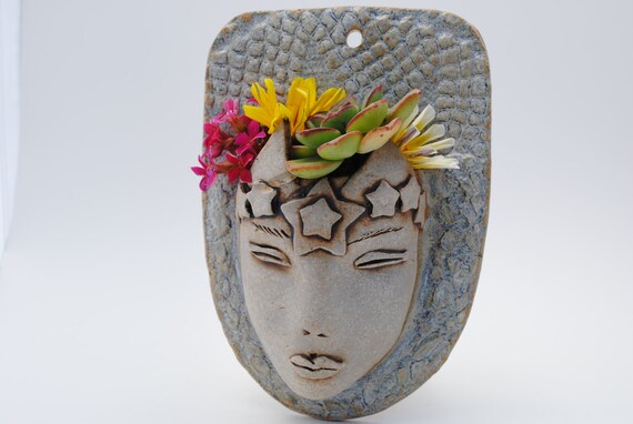 pottery faces garden