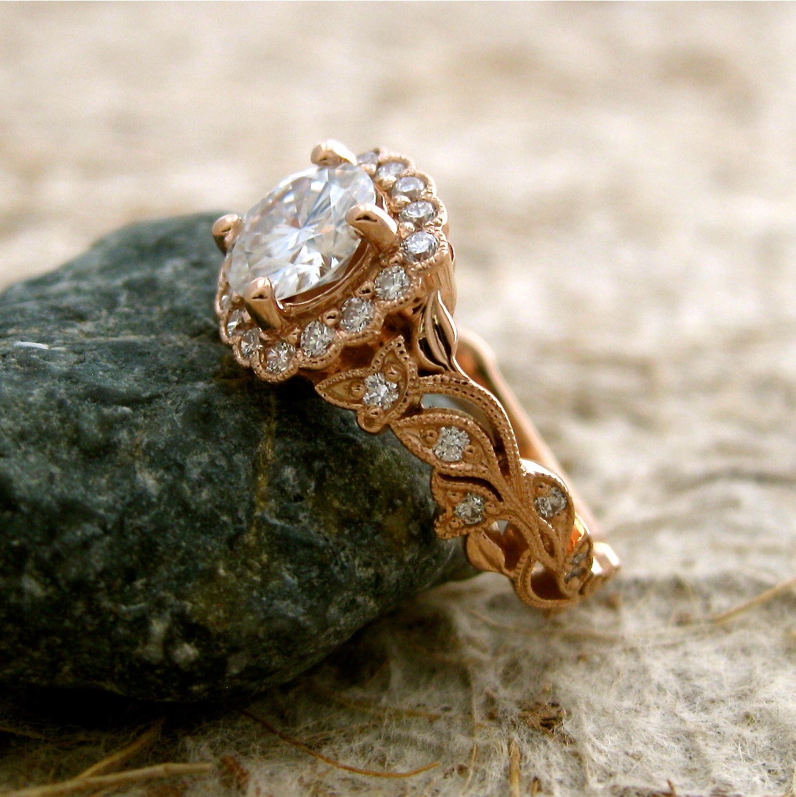 Hand Crafted Round Forever Brilliant Moissanite and Diamond Leaf & Vine Engagement Ring in 14K Rose Gold with Prong Setting and Antiquing