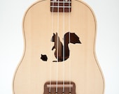 Ukulele (customizable sound hole of choice) Example: Squirrel