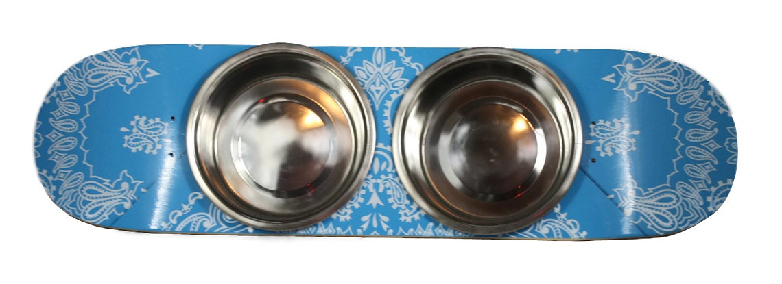 Raised Dog Feeder / Pet Feeder - Carolina Blue made out of a skateboard deck