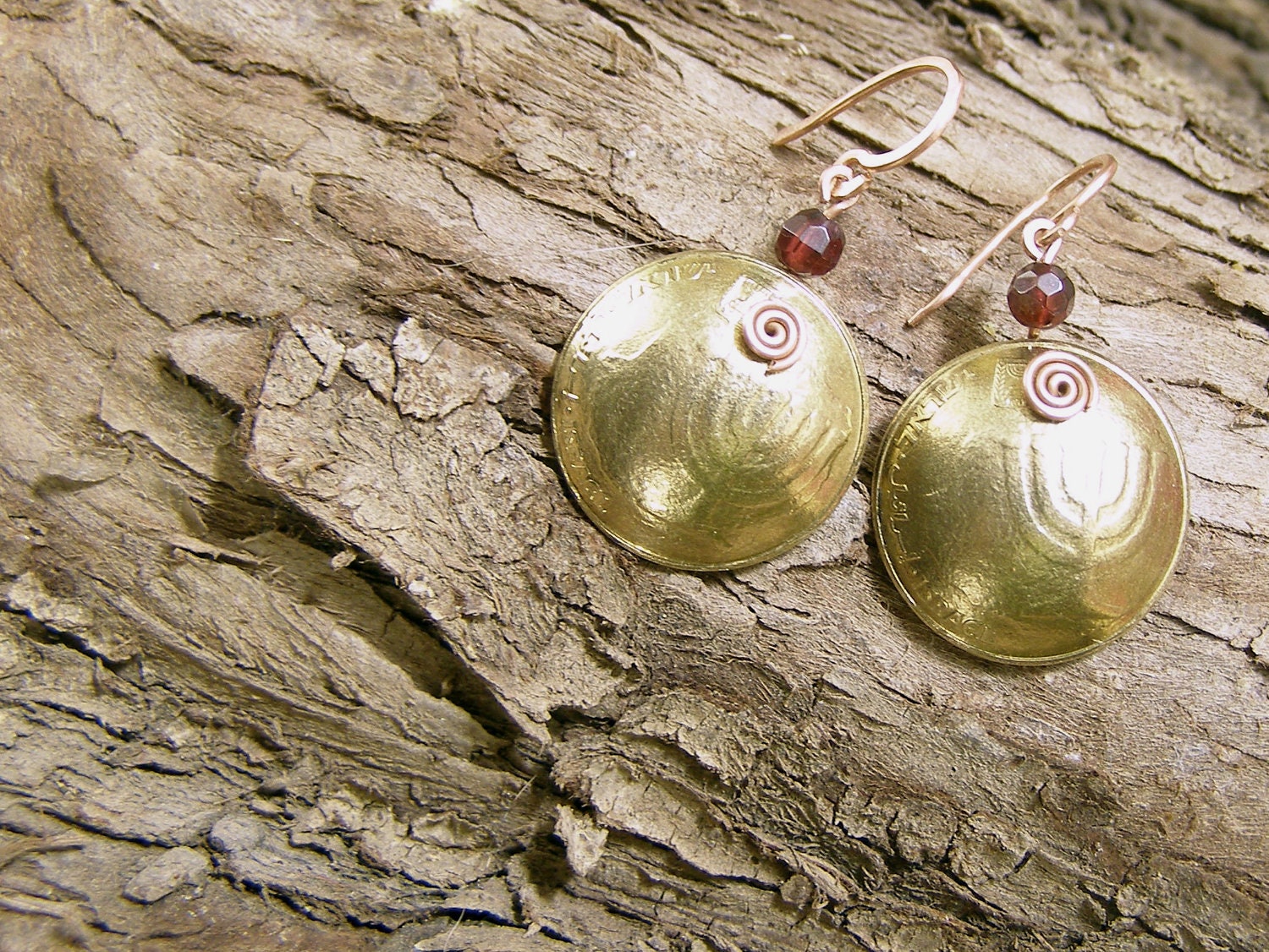 Authentic earrings made of Israeli coins with faceted garnet beads.