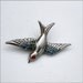 Victorian Revival Silver Swallow Brooch with a Ruby Eye