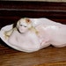 Nude Mermaid resting in a Conch Shell Figurine