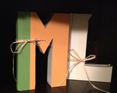 Custom letter made from recycled books