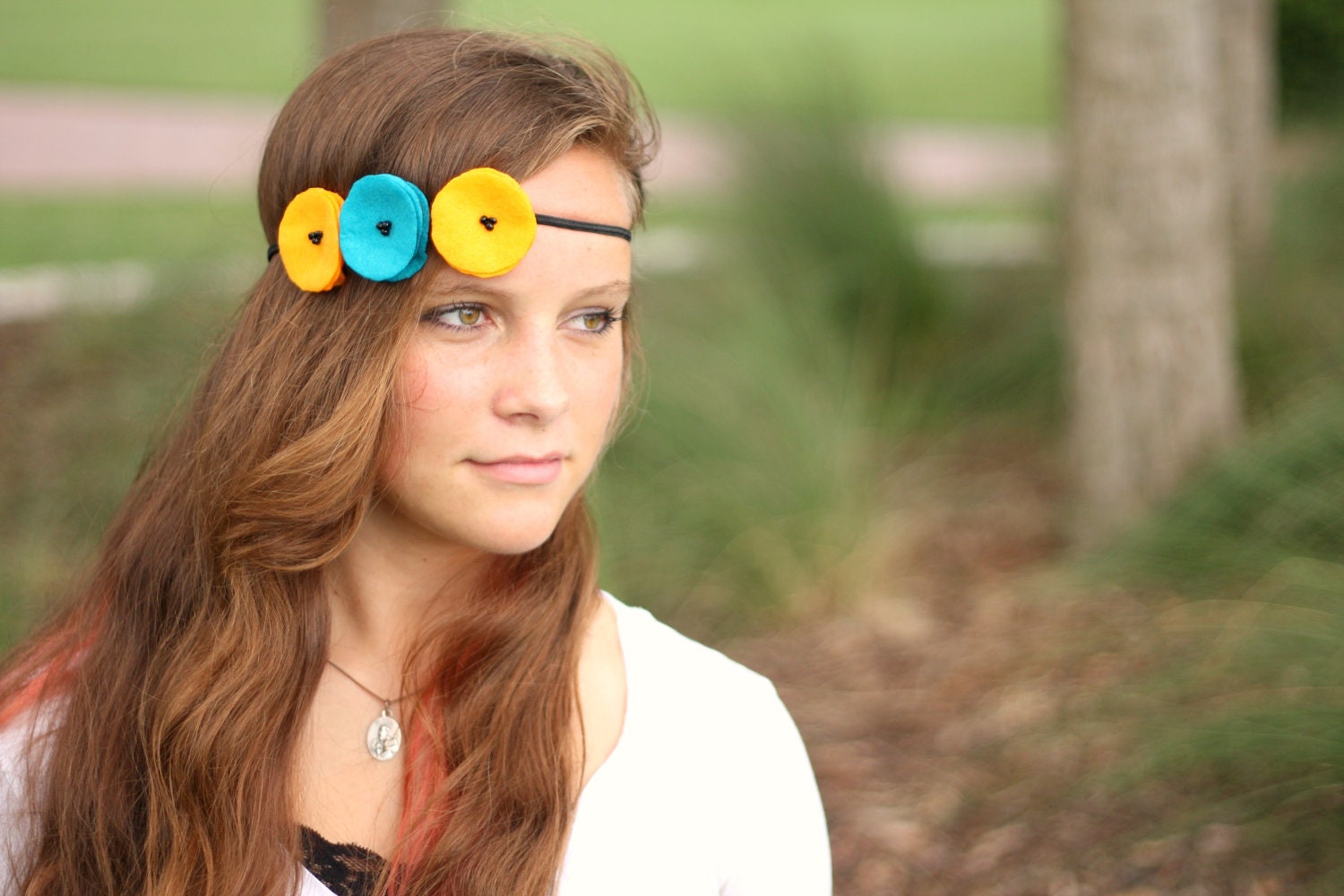 sunburst over the ocean felt poppy garland headband. golden yellow and teal.