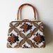 Vintage 1960s beaded handbag with lucite handle