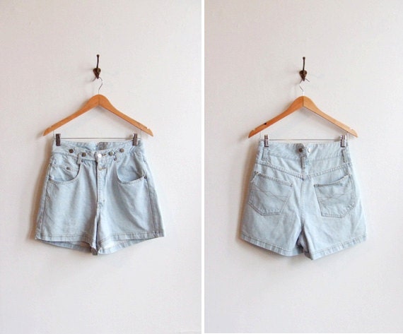 Vintage 1980s light blue denim shorts with silver button detail