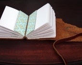 Rough-cut leather journal with strap