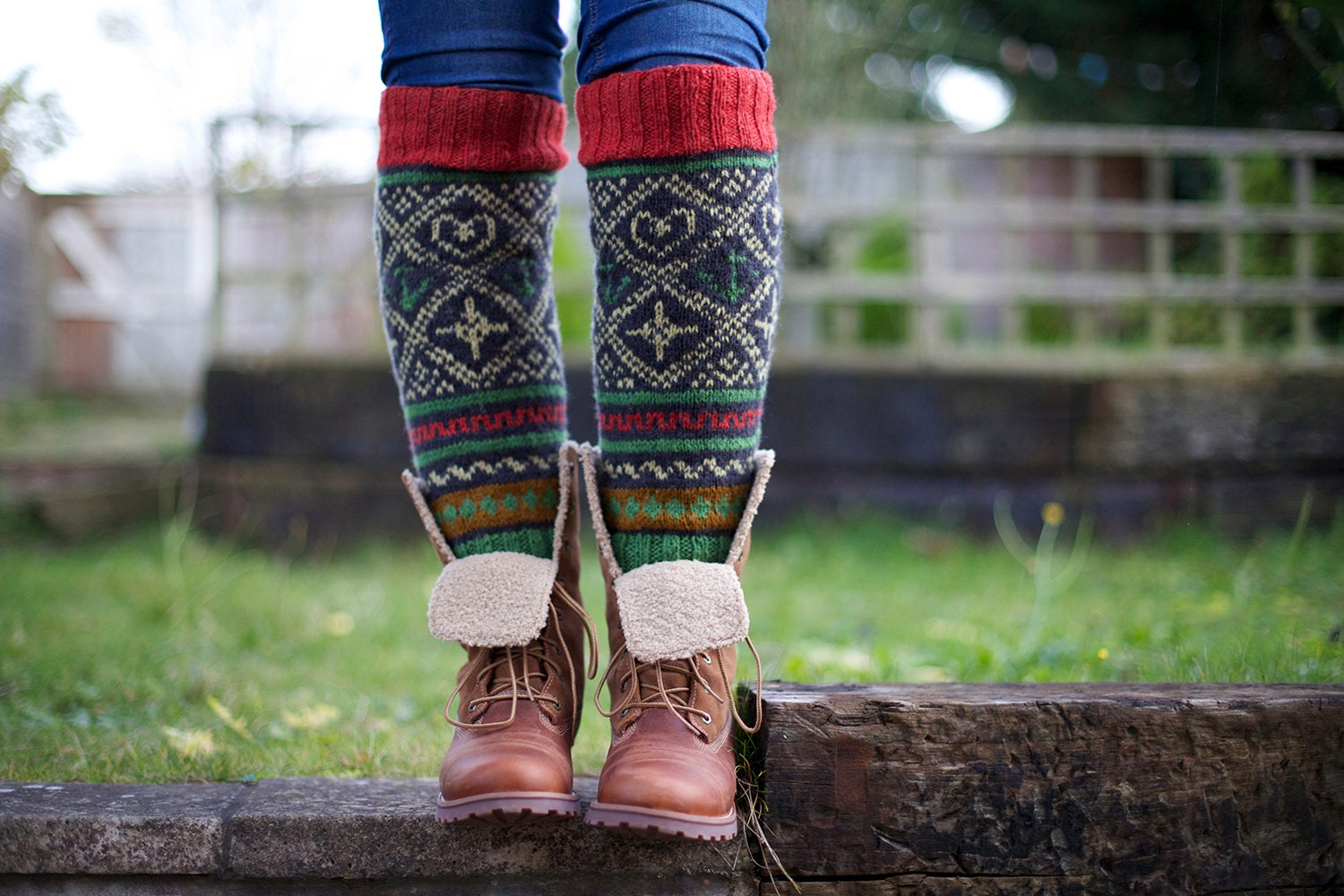 Knee high black knitted socks with Scandinavian ornaments for unisex adults