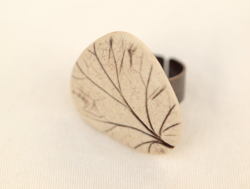Reveal - An earthy porcelain ring with impression of a Coral Bell leaf.