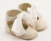 Baby shoes from crystal-embellished beige fish leather