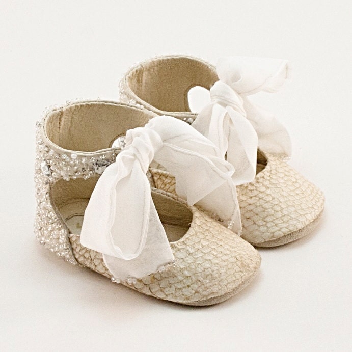 Baby shoes from crystal-embellished beige fish leather
