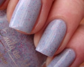 Nail polish - "Somber Party" blue, pink and purple glitter in a grey base