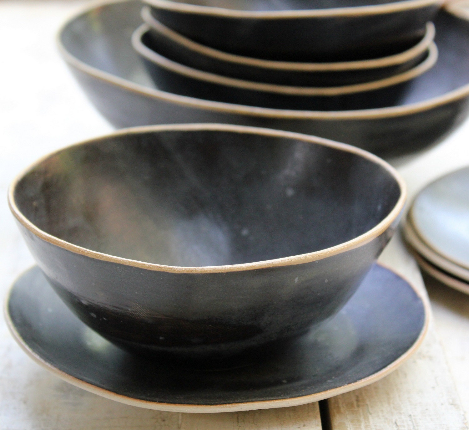 lovely black bowls with plates for soup or salad or cereal...