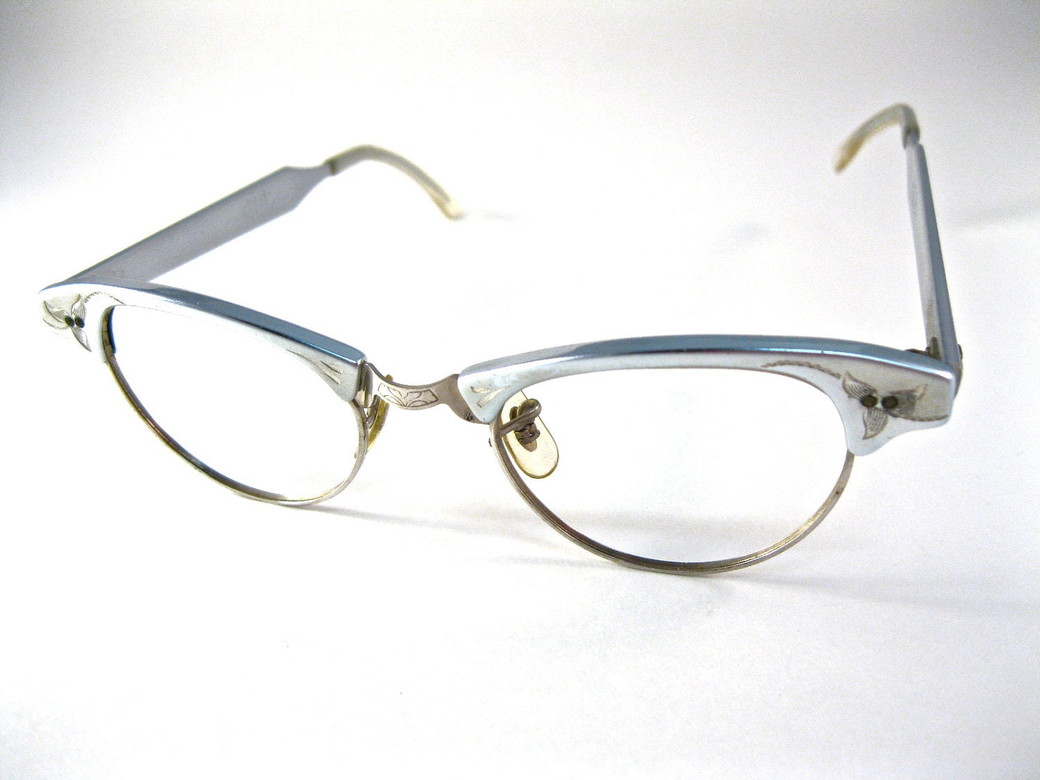silver cat eye glasses. aluminum with etching. ornate. new old stock NOS/deadstock vintage ArtCraft brand. size 44-20 (VFAC)