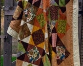 Queen size quilt, fall colors, browns, greens, rust.  Emily Bohemian Tropical Quilt