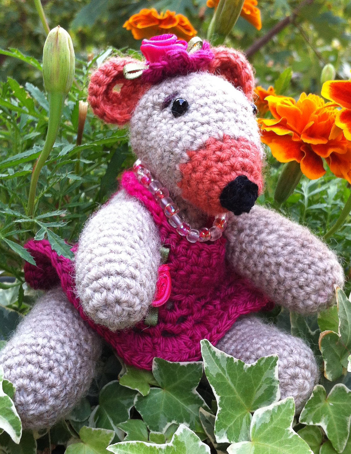 Girly Bear: Knitted toy bear in a fancy pink dress, flowers and necklace