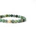 moss agate bracelet with gold focal bead. small stacking yoga stretch bracelet in green, teal, olive and aquamarine.