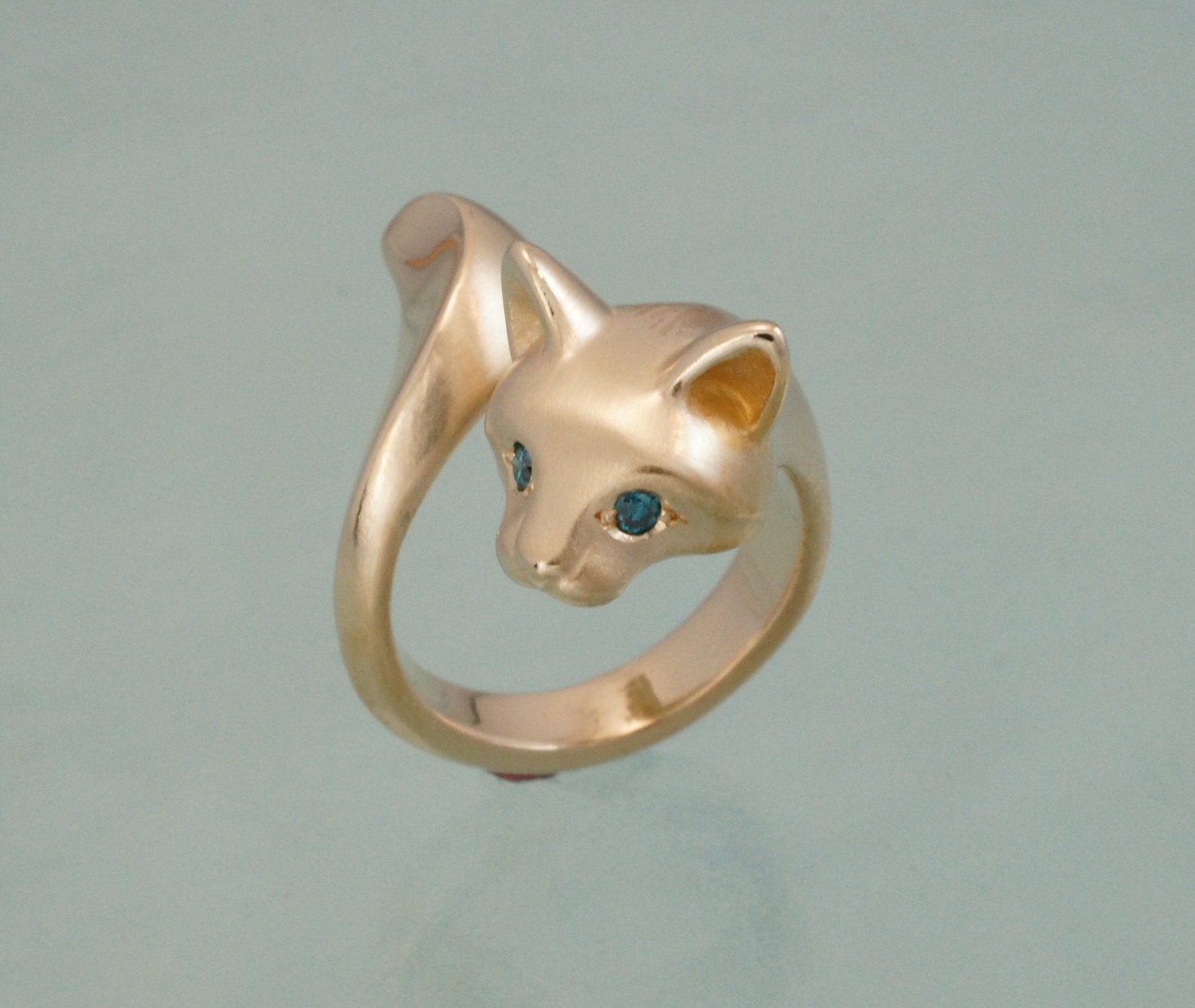 bronze forrest cat with blue diamond eyes( or pick your color)
