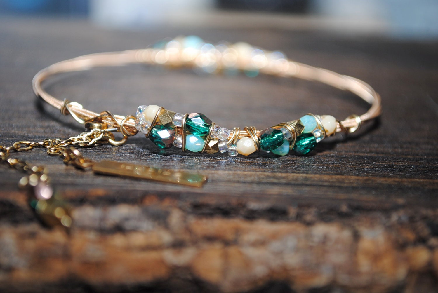 INSPIRE ME Guitar String Charmed Bangle Bracelet/ Greens and Gold/Recycled String Wire Wrapped and Adorned with Chain and Charms