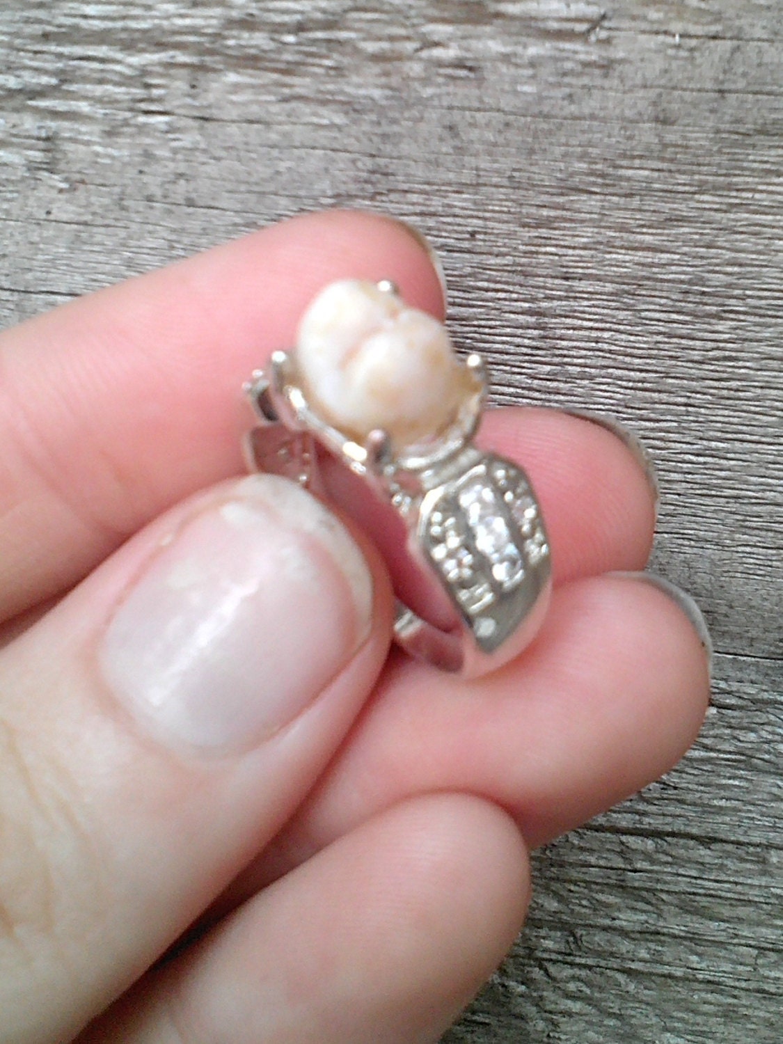 Real human tooth ring with cubic zirconias