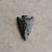 large obsidian arrow head (1 piece)