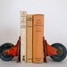 vintage industrial orange castor set/bookends