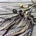 Stunning black cream gold and white chevron braided leather and feather headband belt lariat