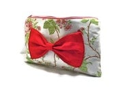 Zippered clutch or makeup bag with red bow