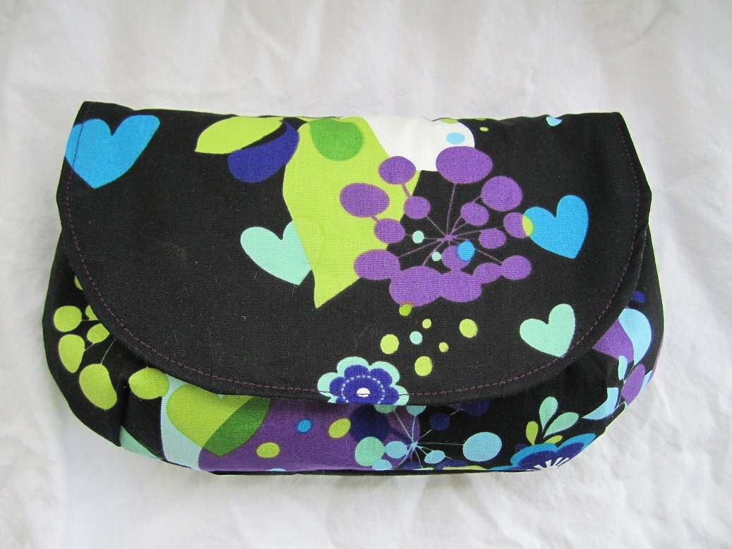 Black with purple, blue and green outside green and white polka dots inside summer clutch flap purse